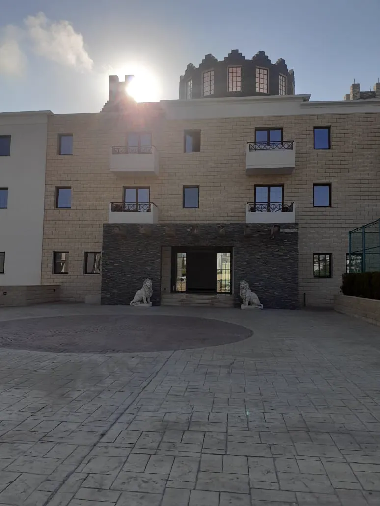 Entrance to the building marked by two lion statues