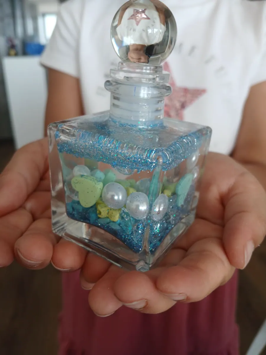 Finished blue Genie Jar filled with crystals, pearls and sparkle