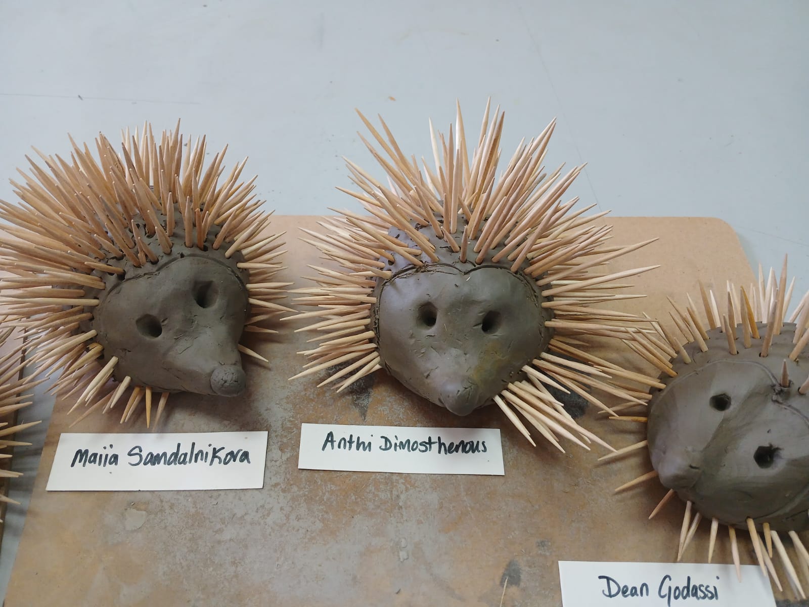 Clay hedgehogs displayed on a classroom table