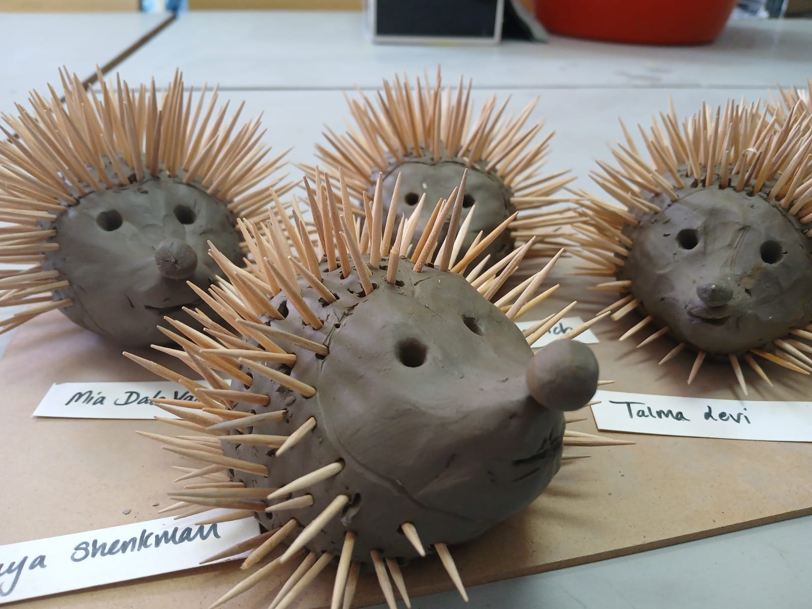 Close view of several clay hedgehog sculptures