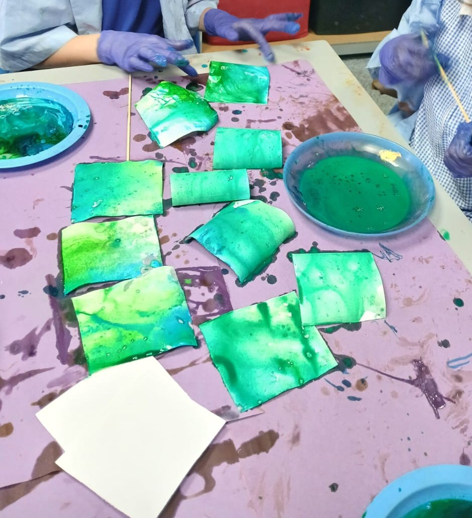 Green painted papers from a creative art session
