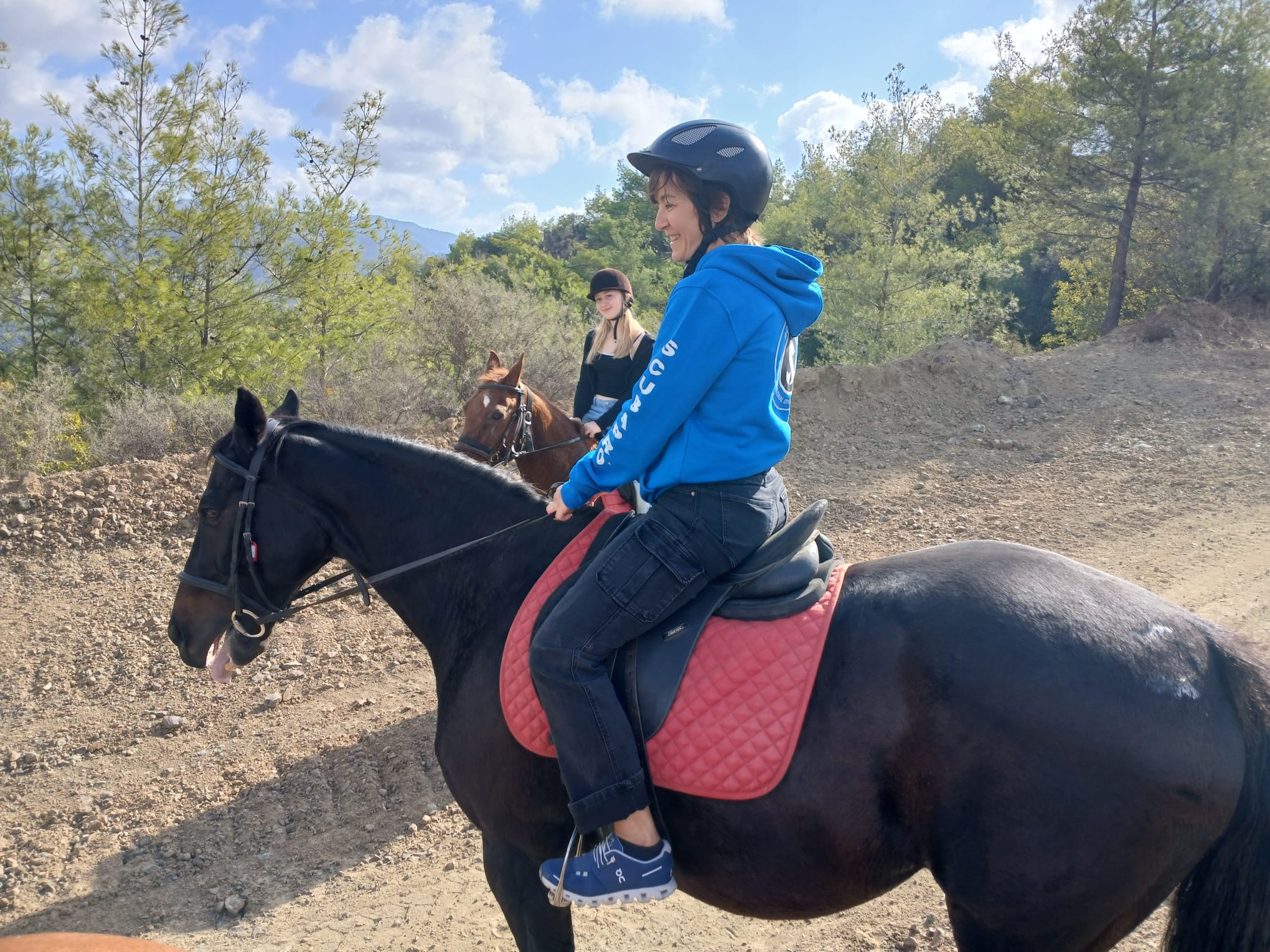Miss Debbie horse riding outdoors