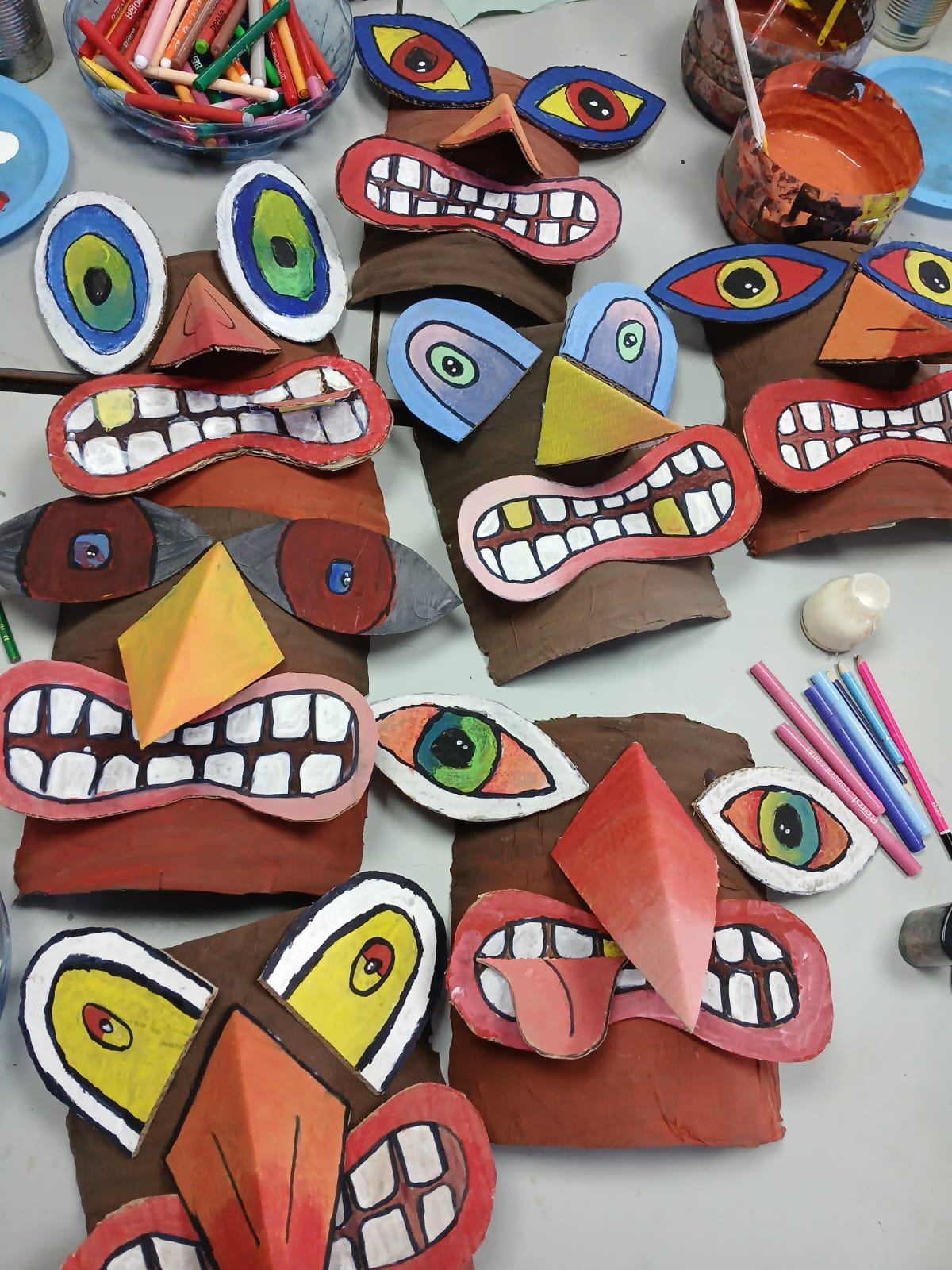 Colourful cardboard masks made by children