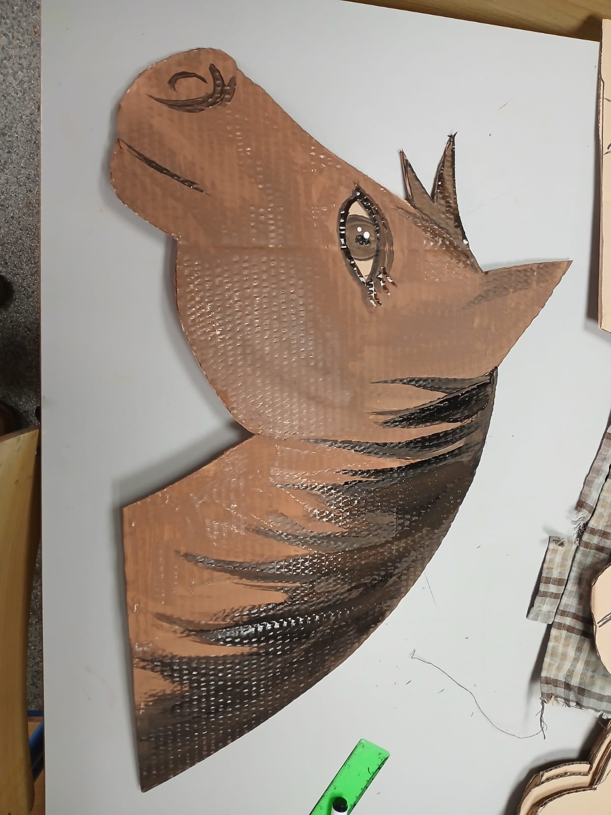 Painted cardboard bird artwork
