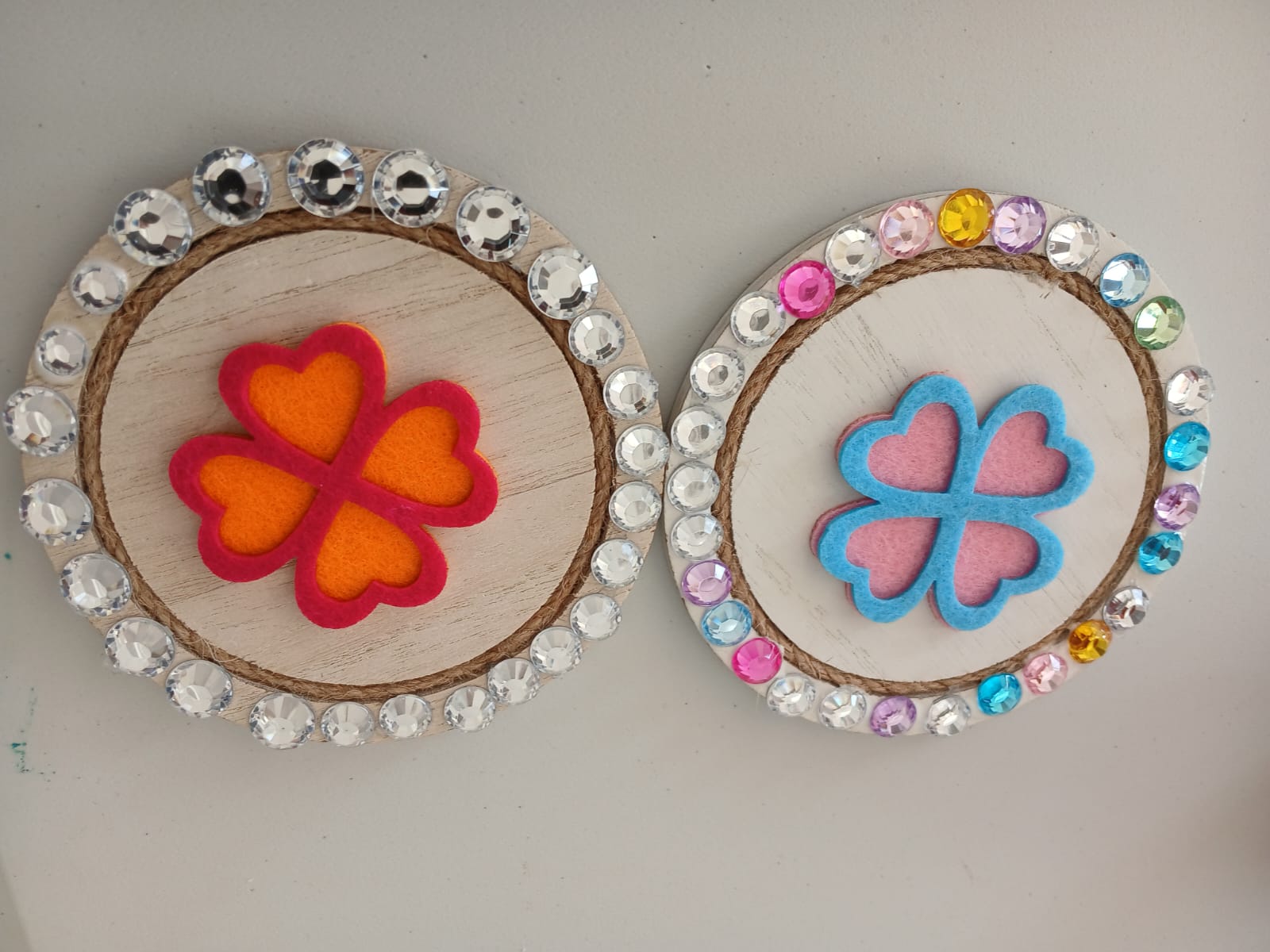 Two handmade heart flower hoops decorated with gems