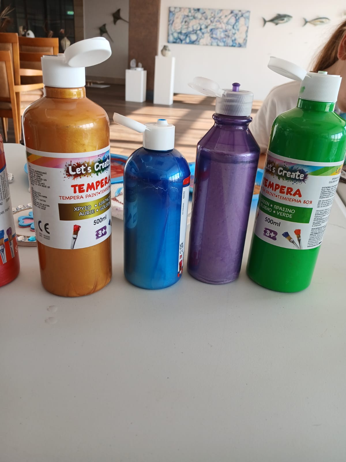 Colourful paint bottles ready for a creative session