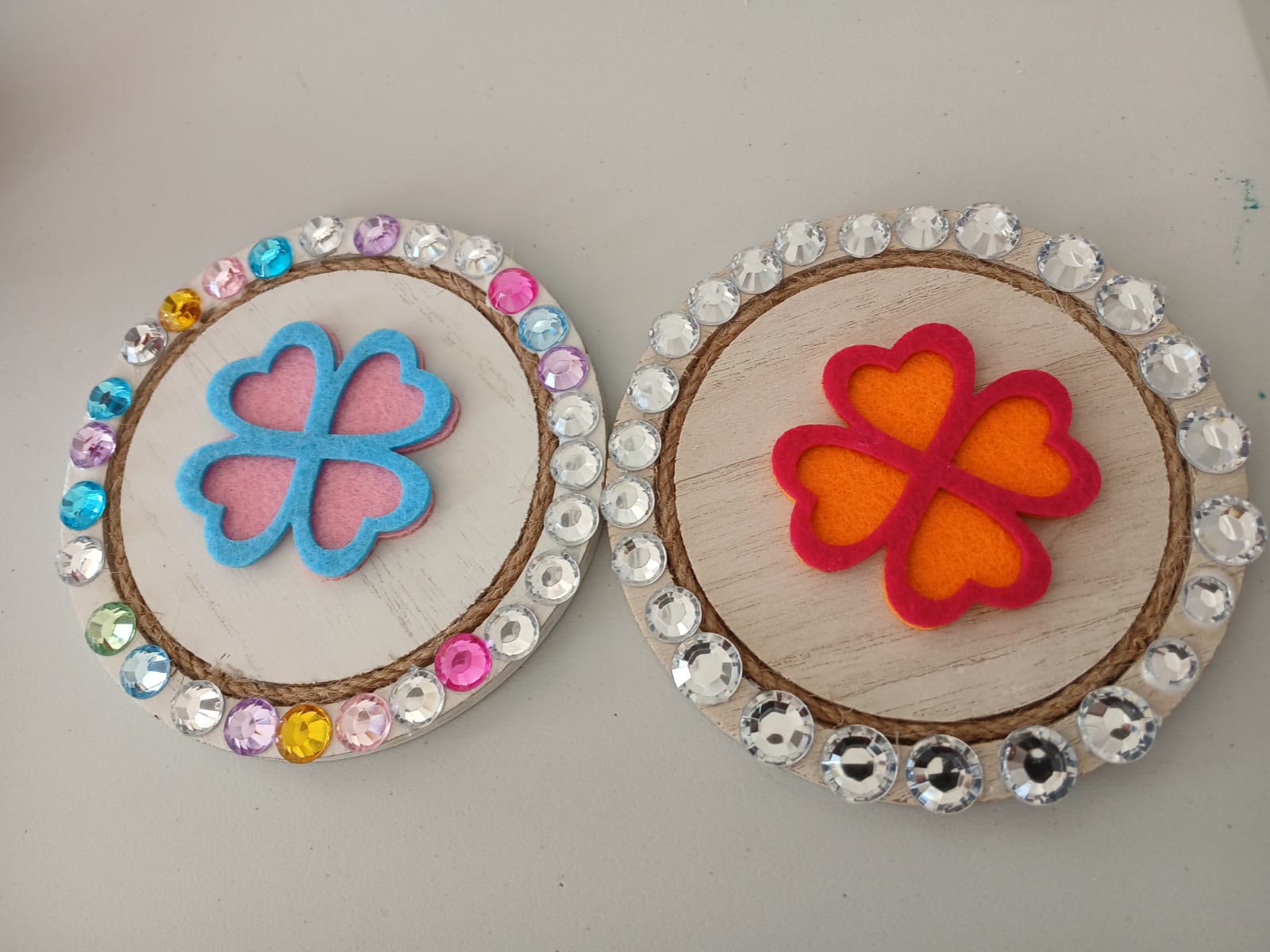 Two handmade heart flower hoops decorated with colourful gems